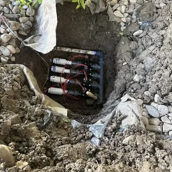 New multi-zone valve manifold set into a freshly dug hole with landscape fabric